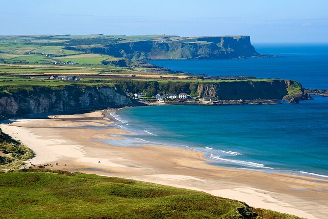 Chauffeur Giants Causeway & Belfast Private Day Tour From Dublin - Dunluce Castle from the roadside