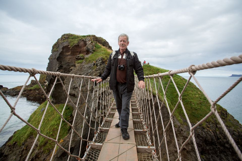 Dublin: Giant's Causeway & Glens of Antrim Day Tour - Dunluce Castle from the coastal road